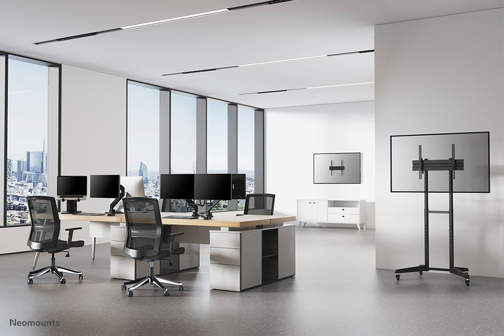 Neomounts NM-D775DX noir est un support de bureau à vérin à gaz avec barre transversale et levier pour écrans plats jusqu'à 32 pouces (81 cm).